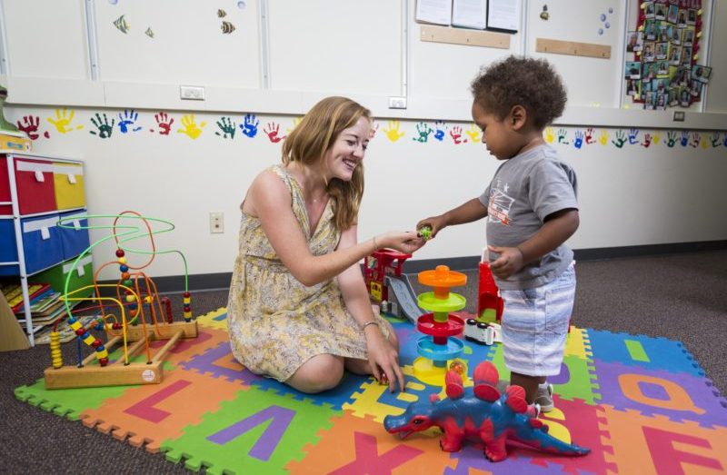 A child plays with toys in the lab